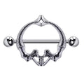 Front view of a gothic nipple shield shaped like a human pelvis or mirrored mermaids
