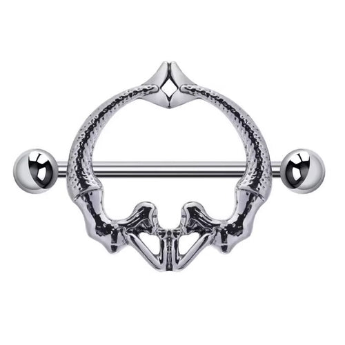 Front view of a gothic nipple shield shaped like a human pelvis or mirrored mermaids