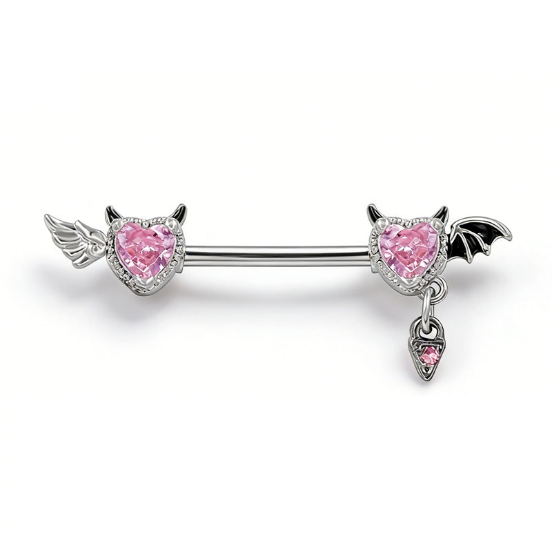 Side-by-side view of an angel and devil themed nipple barbell with pink heart crystals on a white background.