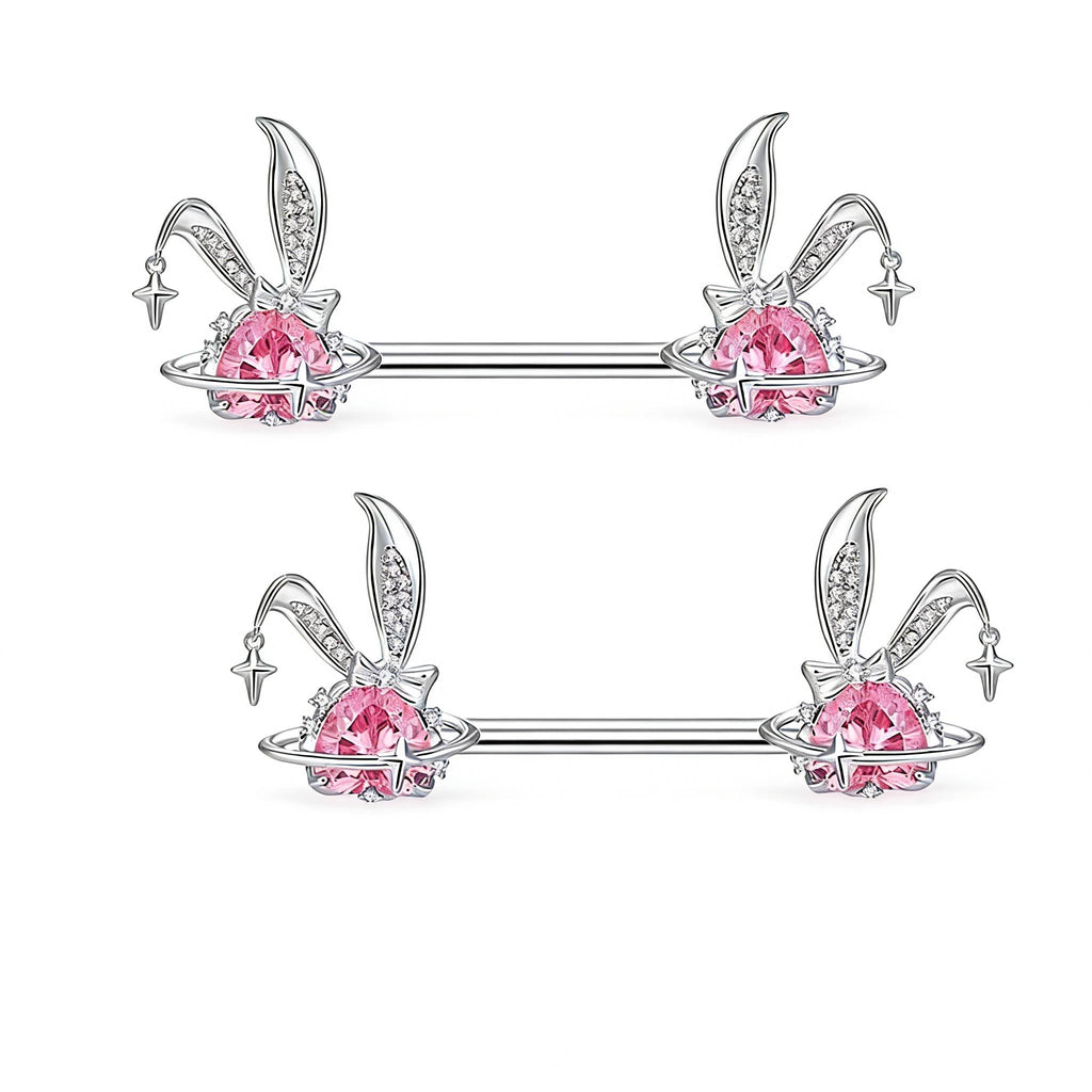 Two sets of bunny ear nipple jewelry with pink crystals and celestial rings