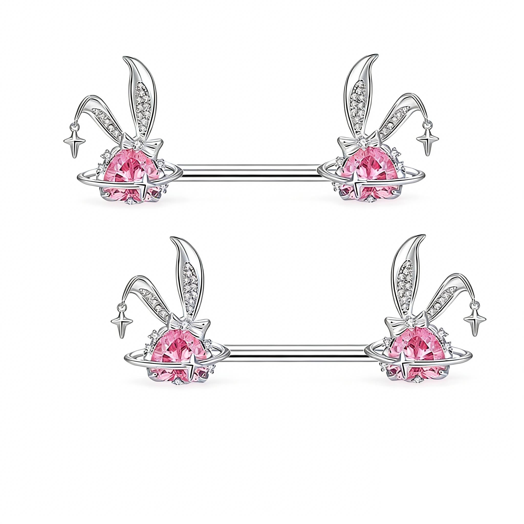 Two sets of bunny ear nipple jewelry with pink crystals and celestial rings
