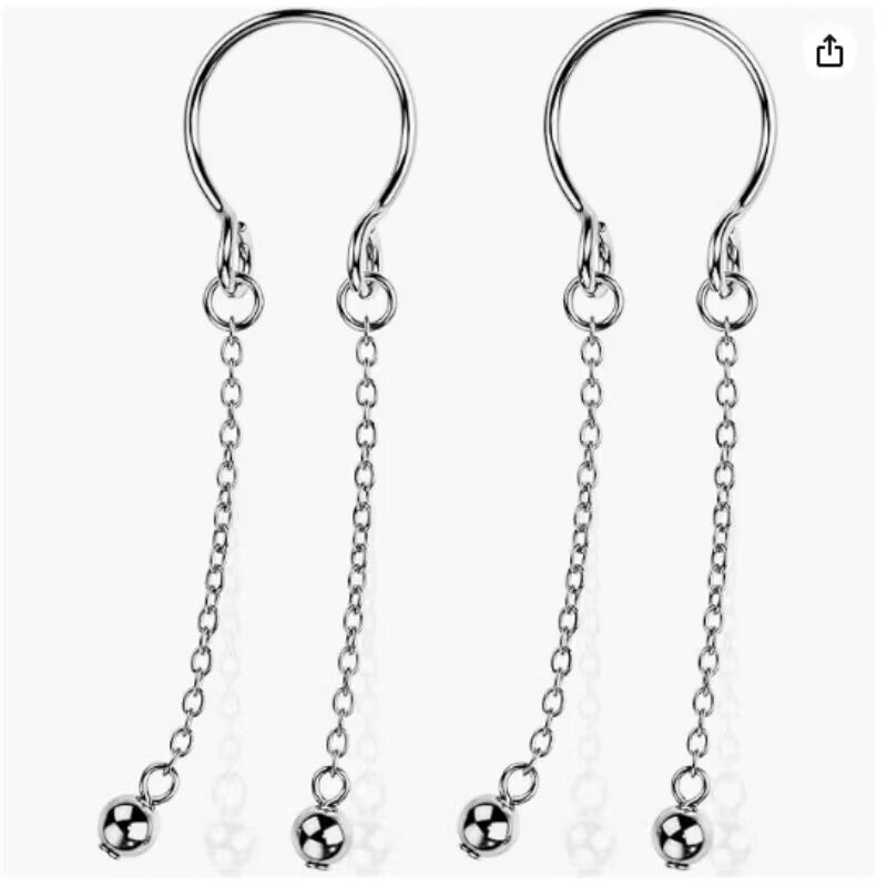 A pair of minimalist non-piercing nipple cuffs with sleek adjustable U-hoops and long dual dangling chains finishing with smooth metallic round balls, shown against a plain white backdrop.