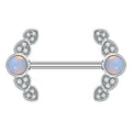 Front view of a single silver-colored nipple ring featuring a glowing center opal framed by micro-pave crystal heart wings against a white background.