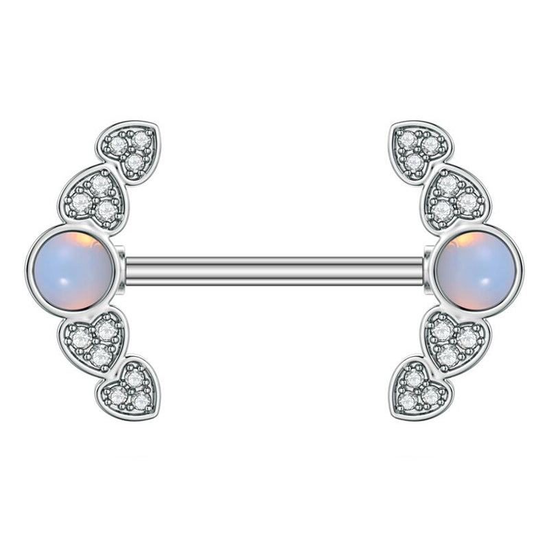 Front view of a single silver-colored nipple ring featuring a glowing center opal framed by micro-pave crystal heart wings against a white background.
