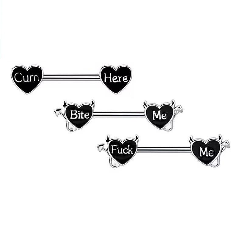 A set of three black heart nipple rings with naughty devil horns and different gothic words.