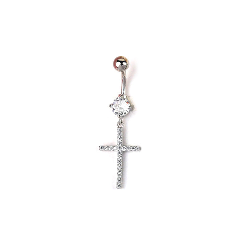 A silver-colored navel piercing ring with a brilliant round-cut main crystal and a dangling pave cross pendant, showcasing a classic and sleek look