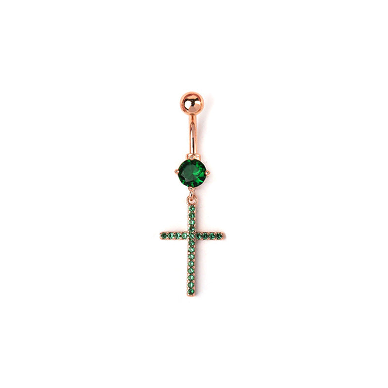 A dangle navel piercing jewelry piece showcasing an emerald green round crystal and a rhinestone cross pendant on an elegant rose gold-tone barbell