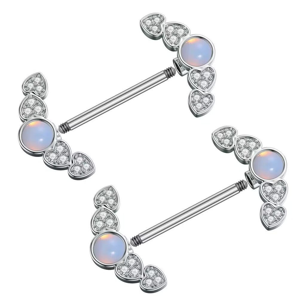 Side angle of a pair of nipple piercing jewelry showing the externally threaded straight bar and detachable decorative heart-shaped ends.