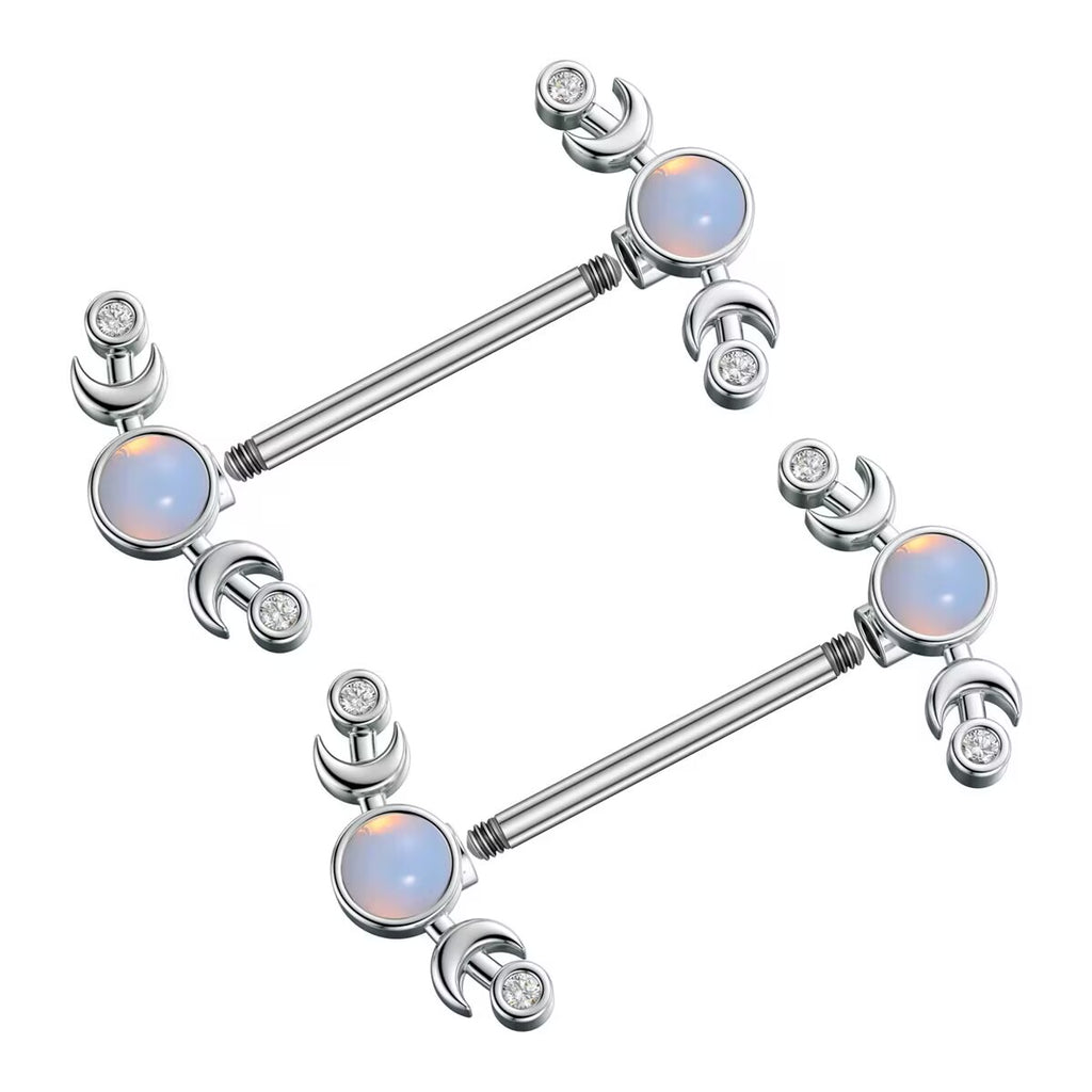 Two pieces of crescent moon piercing barbells showing the external threading on the bar ends and the detachable decorative ends.