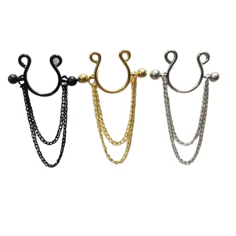 A set of three faux nipple rings with double dangle chains in black, gold, and silver colors.