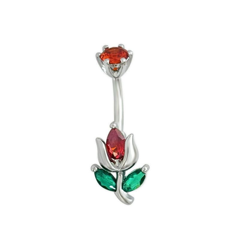 Curved belly button ring in silver tone featuring a blooming flower design with a red teardrop crystal and green marquise leaf gemstones