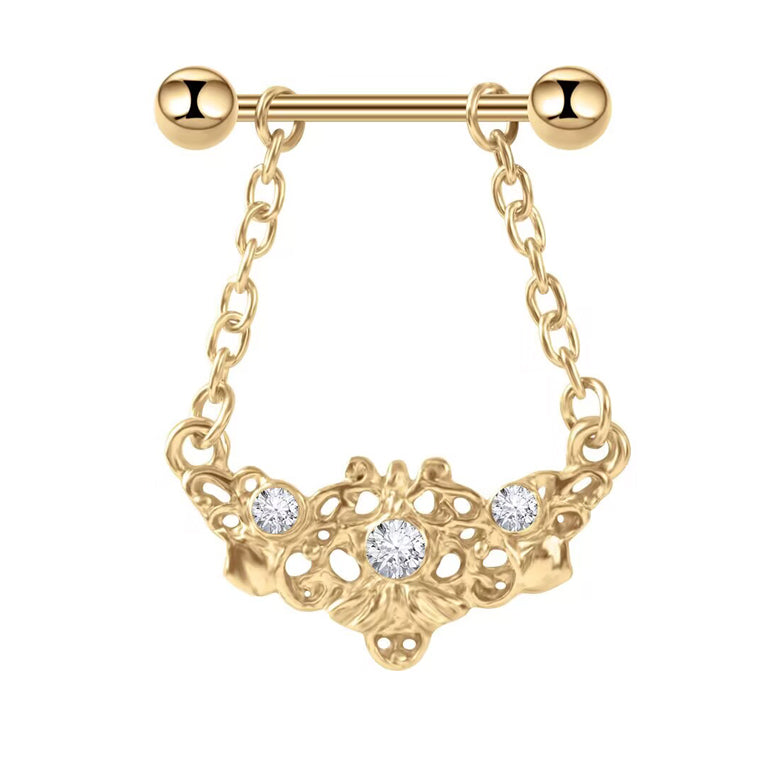 Front view of a gold filigree nipple shield with three crystals and hanging chains on a white background