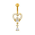 Front view of a gold heart-shaped belly button piercing with mini wings and a dangling pear-shaped drop
