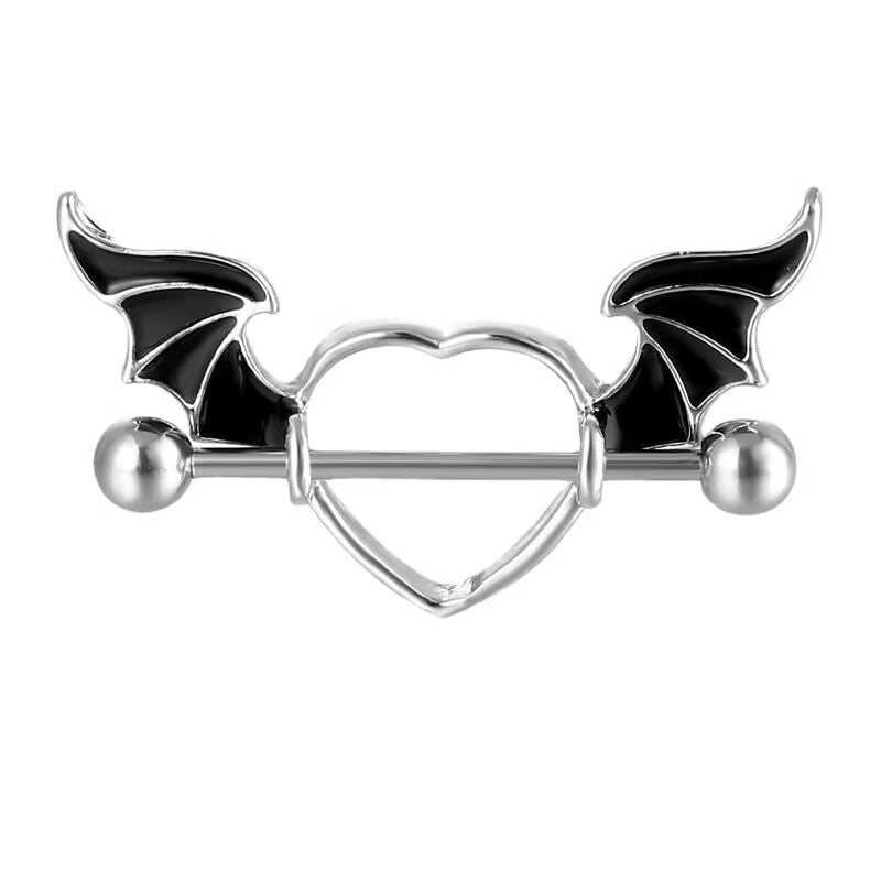 Front view of a gothic bat wing nipple shield with black wing details and silver heart frame.