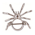 Front view of a silver spider-shaped nipple shield piercing