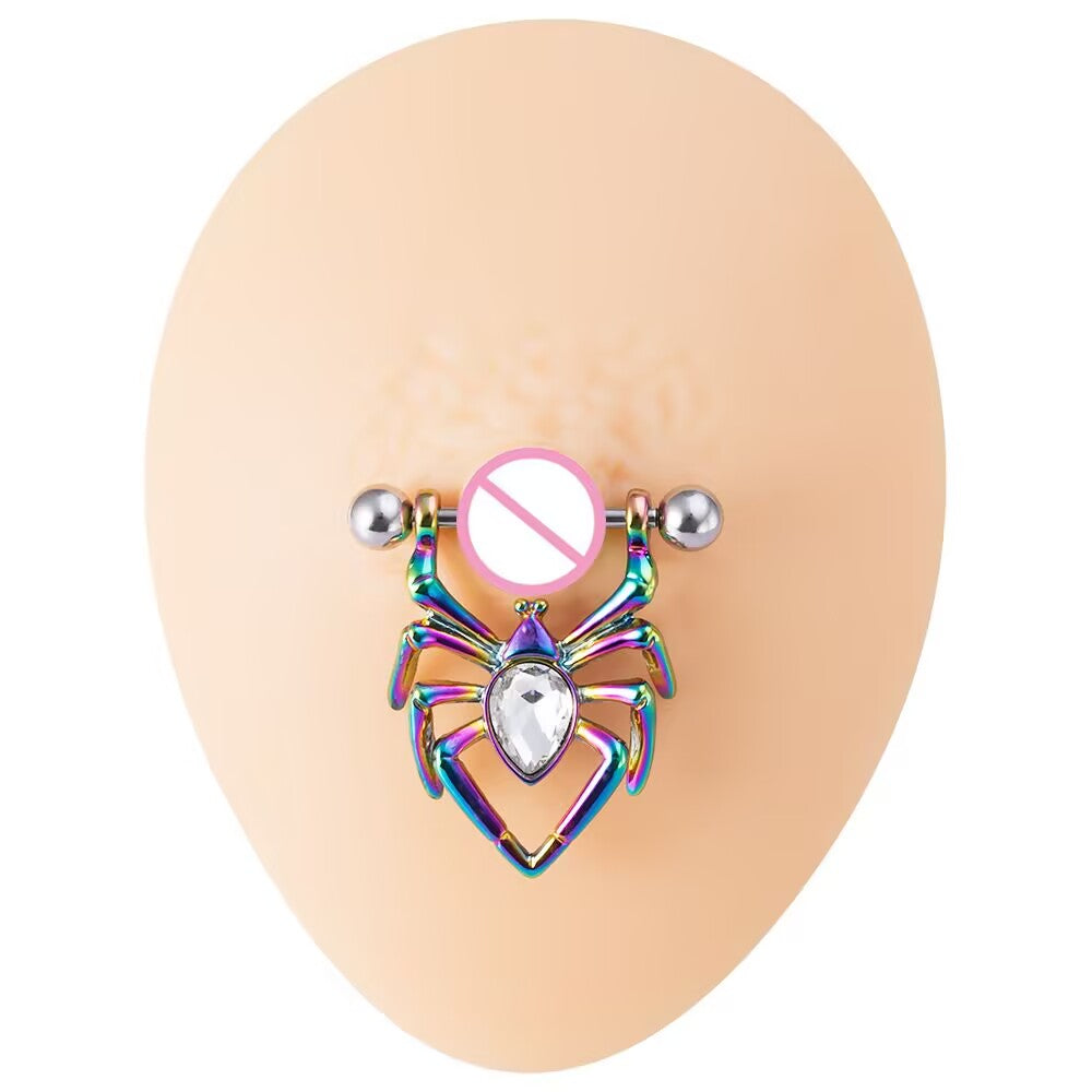 An iridescent rainbow anodized spider nipple shield ring with a large clear crystal gem, displayed on a nude silicone model.