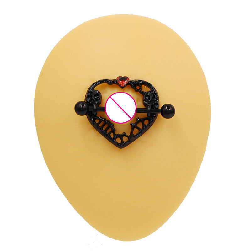 Professional demonstration of heart skull nipple shield on a silicone model.