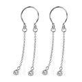 A pair of silver-colored non-piercing fake nipple rings featuring U-shaped adjustable cuffs and dual dangling chains adorned with shimmering crystal droplets at the ends, isolated on a white background.