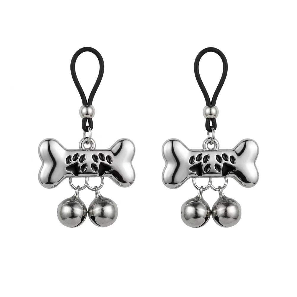 A pair of non-piercing puppy play bone nipple loop clamps with jingling bells, set against a clean white background