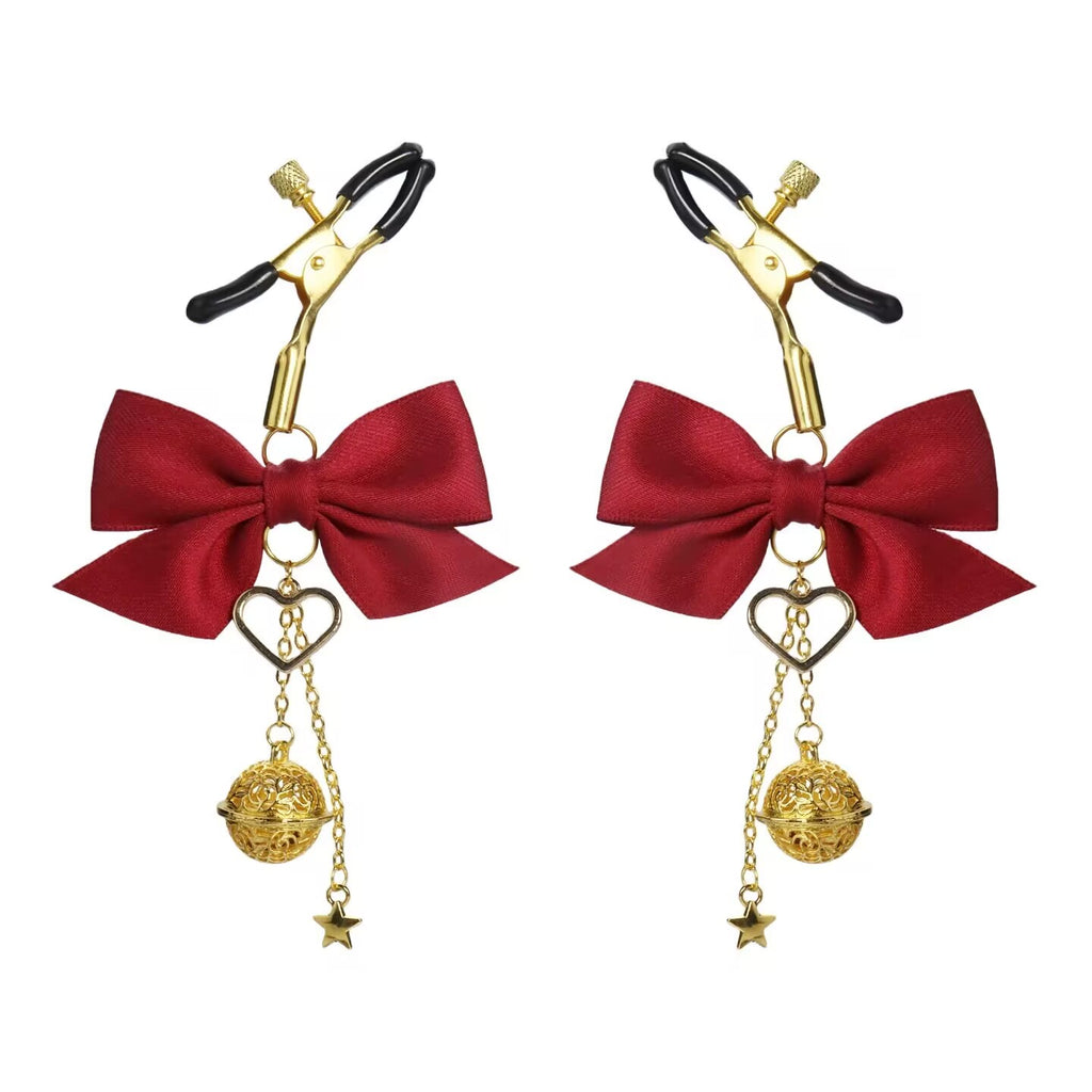 A pair of deep red bow nipple clamps with gold heart and bell tassels.