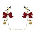 Adjustable sensory clamps with red bows and golden filigree bells.