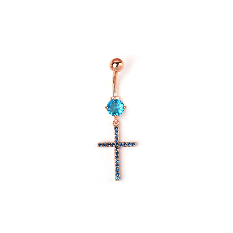 Rose gold belly ring with a sparkling blue round stone and a hanging cross pendant embellished with fine blue crystals