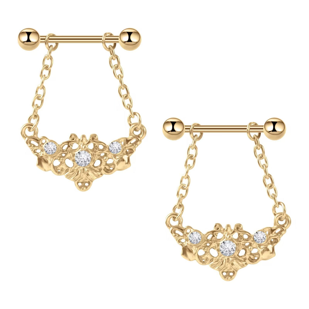 A pair of matching vintage style gold nipple shields with ornate decorative drapes