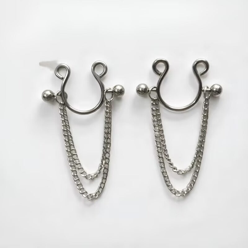Two silver-colored faux nipple rings with elegant drop chains for alternative aesthetic styling.