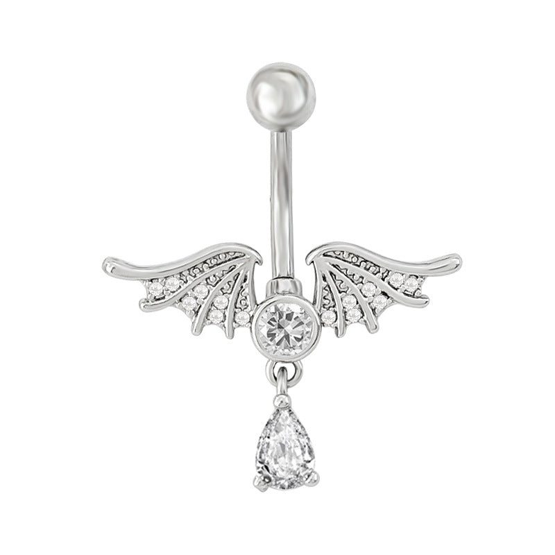 High-resolution shot of a silver demon wings belly button ring with a shimmering center stone and a single teardrop charm.