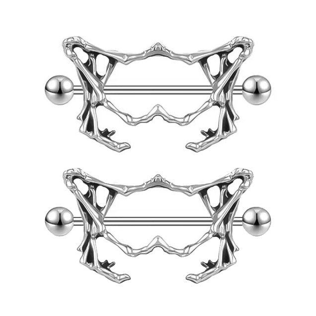 A pair of gothic skeleton pelvis nipple rings for body jewelry styling.